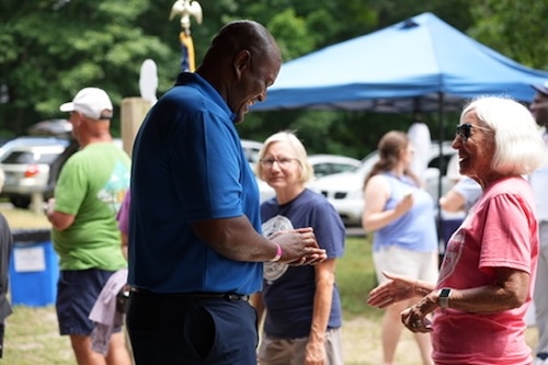Photo of Joe speaking to someone at the Ottawa County Democratic Party Summer Picnic