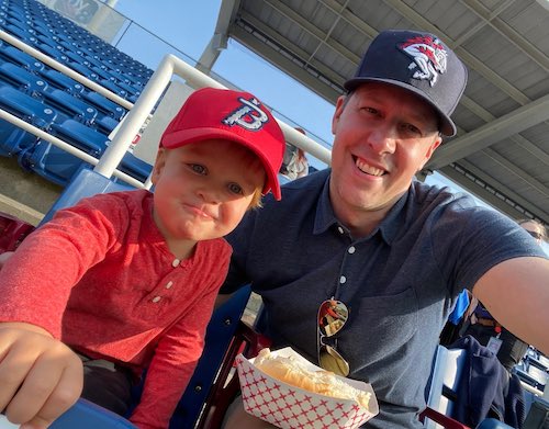 Josh and his son at a Rumble Ponies game