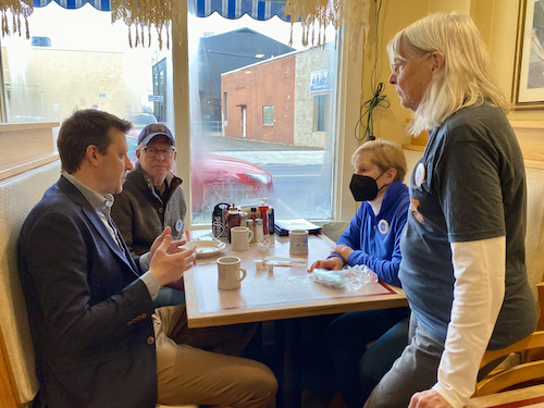 Josh with voters at a diner in Schodack