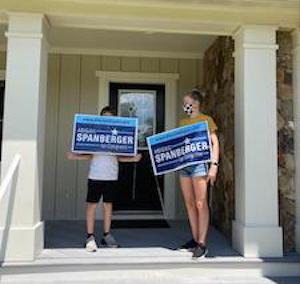 Young volunteers helping with signs!