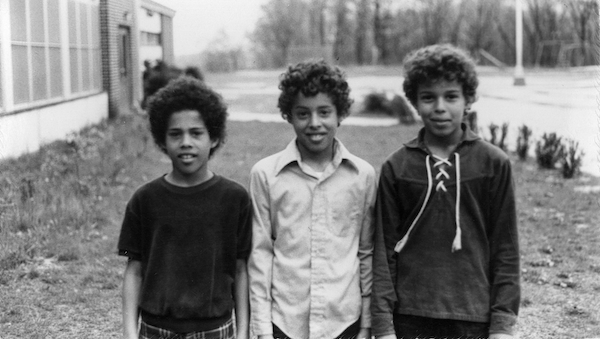 Anthony Brown as a child with two other children.