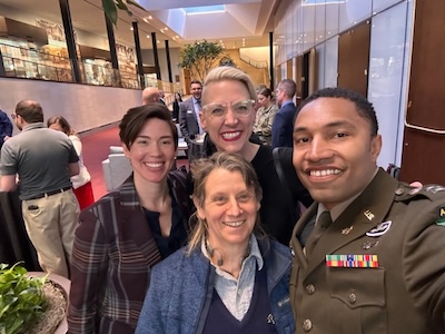 Photo of Adam in uniform with others