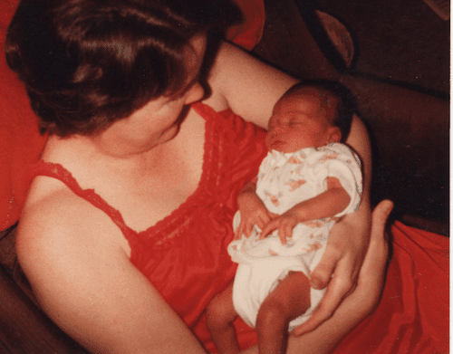 Photo of Colin's mom holding him when he was an infant