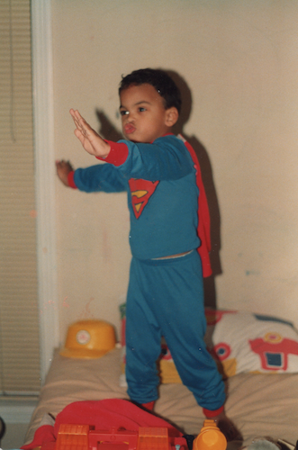 Childhood photo of Colin dressed as Superman