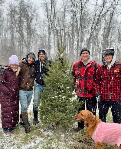 Blake and his family with their Christmas Tree