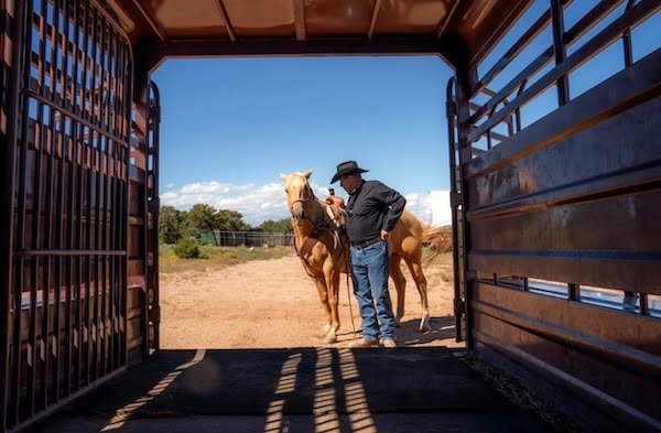 Photo of Sam Bregman with a horse