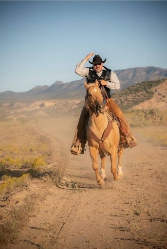 Sam Bregman riding a horse 