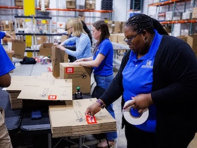 Brooke helping pack boxes at the Maryland Food Bank