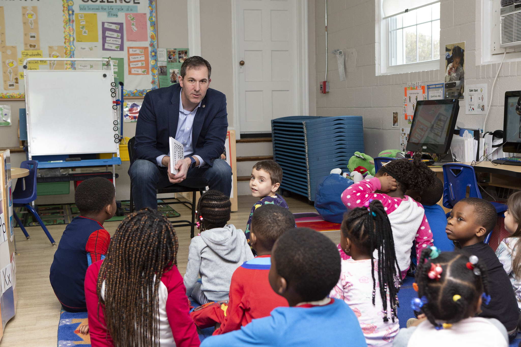 Johnny reading to children.