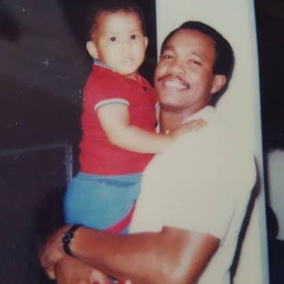 Jason as a baby, held by father