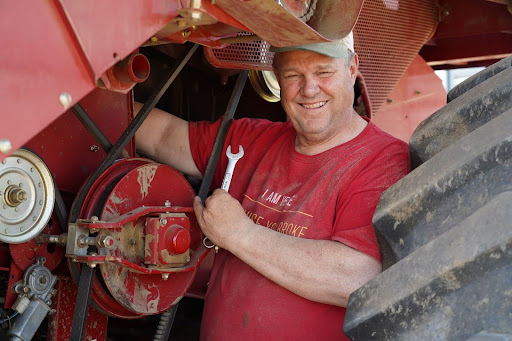 Jon Tester holding a wrench