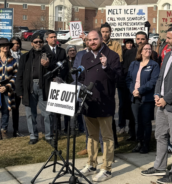 Photo of Jeremy speaking at a Stop ICE rally