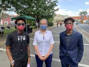 Abigail at a Voter Registration event organized by two local high school students. Abigail and the two students took time to take a photo together. 