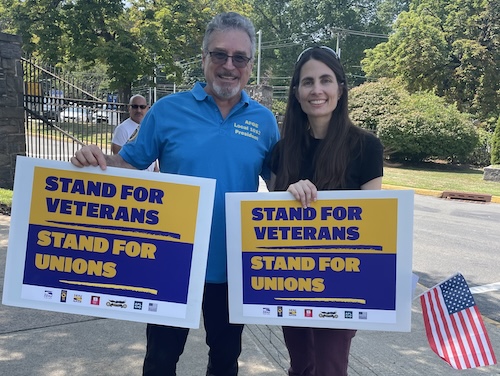 Photo of Megan protesting outside of the VA in support of unions