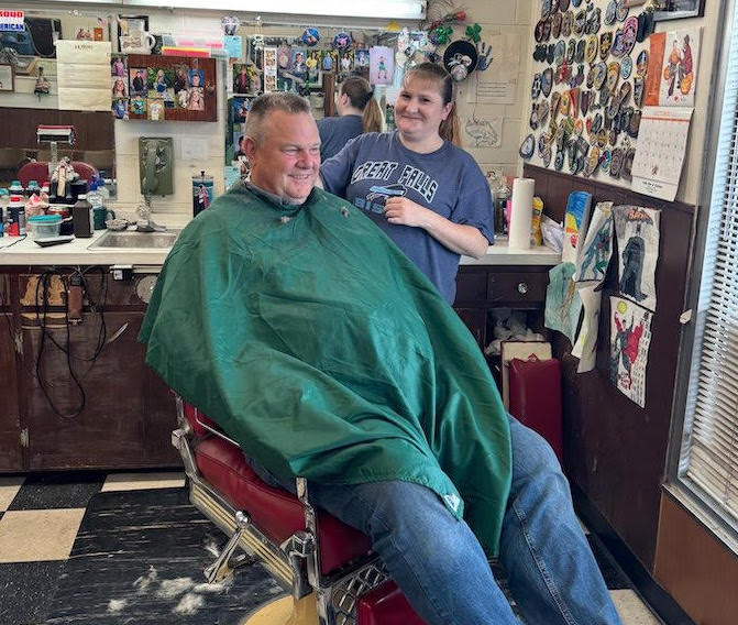 Jon Tester getting his hair cut.