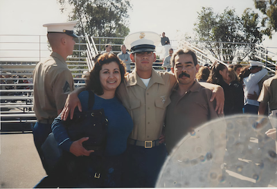 Picture of John in military uniform and with his parents