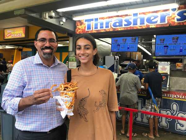 Mireya and John in Ocean City eating French Fries