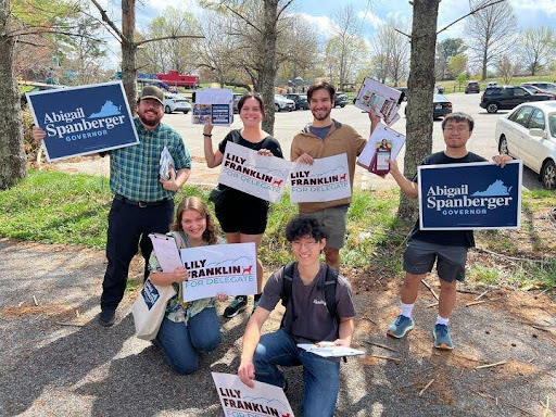 Organizers and volunteers holding up Abigail Spanberger and Lily Franklin signs.