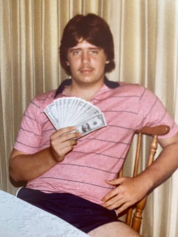 Young Dale with $1 bills