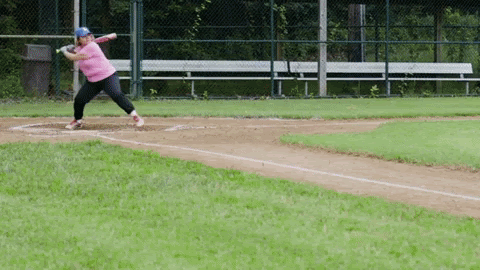 Linda playing baseball.