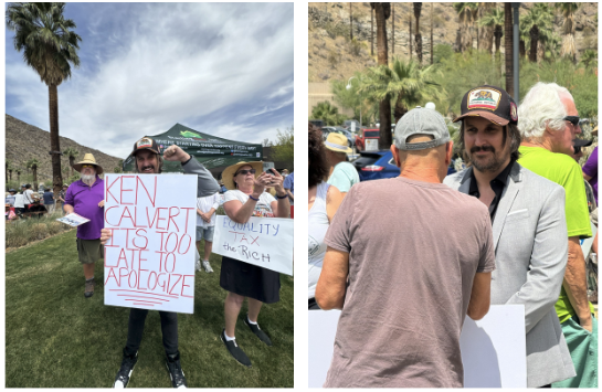 Tim holding protest sign