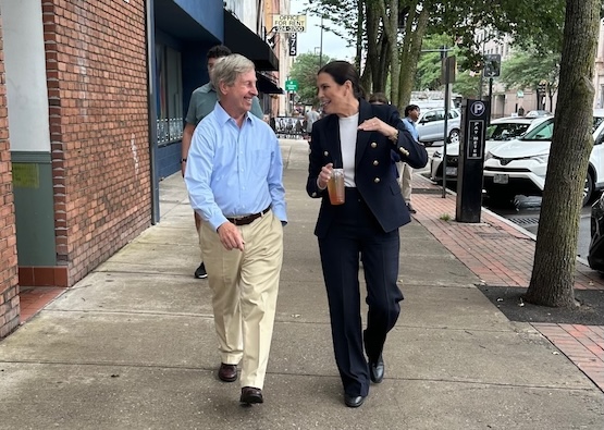Stefany Shaheen and Gov. John Lynch walking and talking.