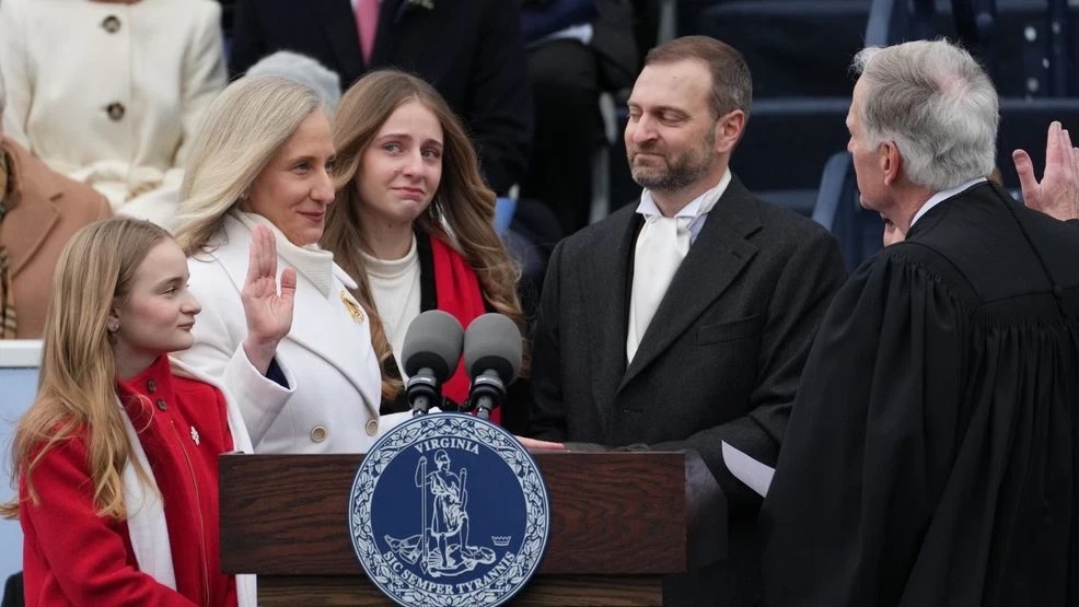 The moment I was sworn in with my husband, Adam, and our daughters by my side.