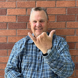 Jon Tester holding up 2 fingers