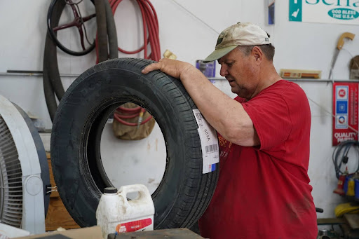 Jon Tester changing a tire