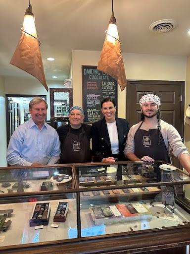Stefany Shaheen with chocolate shop employees.