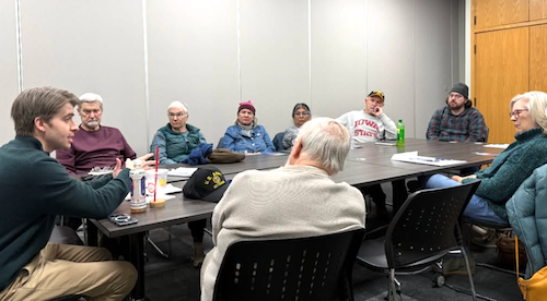 Photo of Taylor talking with Iowans