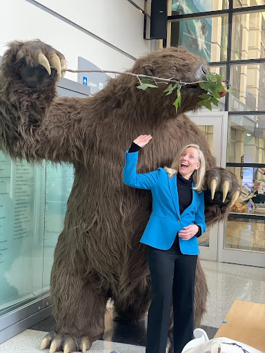 Abigail next to a massive sloth at the Virginia Museum of Natural History in Martinsville